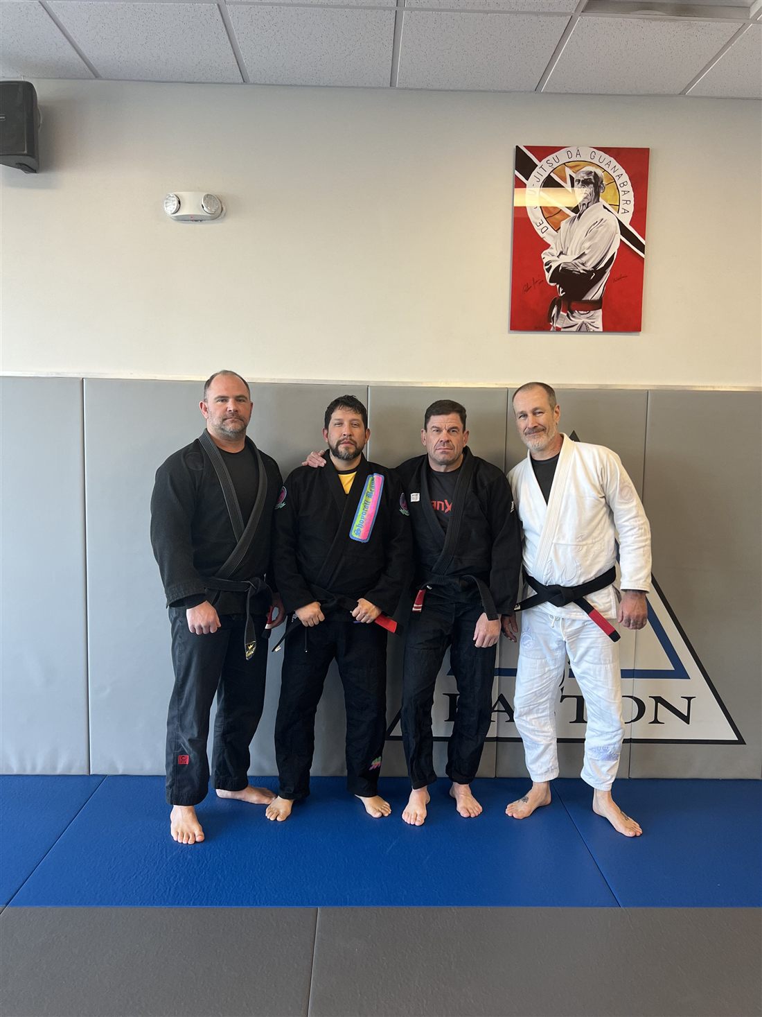 Professor Eli Cancino with fellow black belts at Easton in Colorado